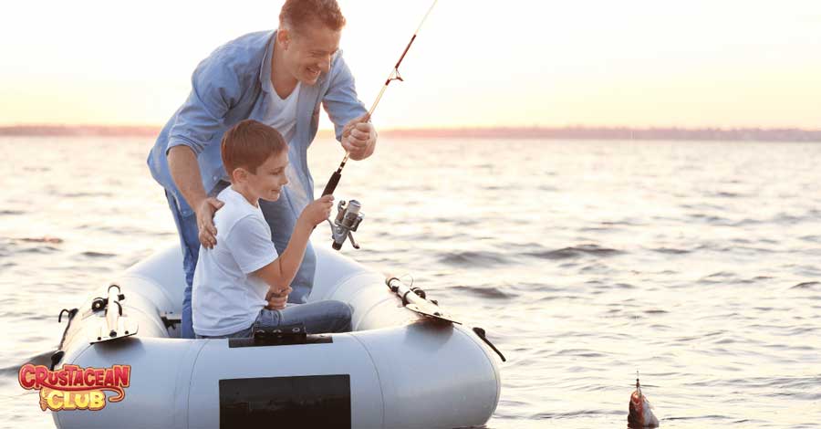 A young boy being taught to fish