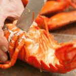 Lobster dishes being prepared in a kitchen